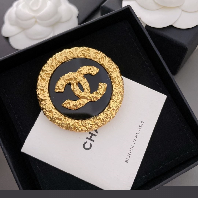 Ch*el brooches